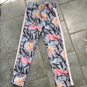 Floral jogger pants with white racing stripes